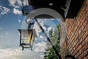 Vintage old medieval looking street lantern hanging on the wall