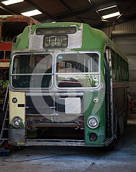 Vintage old retro green bus in garage