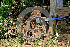 Vintage old rusty iron wheels of a tractor. selective focus