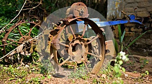 Vintage old rusty iron wheels of a tractor. selective focus