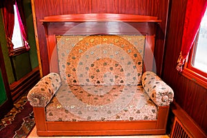 Vintage old sofa in the compartment interior
