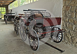 Vintage old style chariots in barn