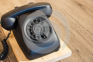 Vintage old telephone on wood table