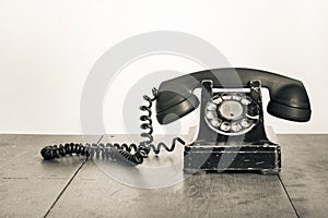 Vintage old telephone on wooden table