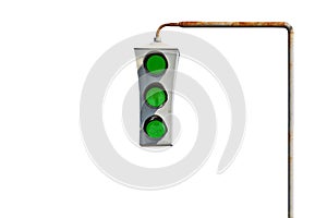 Vintage old traffic light on a rusty post. All lights are green. The concept of good luck and unhindered travel. photo