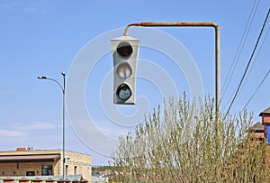 Vintage old traffic light on a rusty post. Close-up