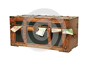 Vintage old trunk with money isolated on a white background