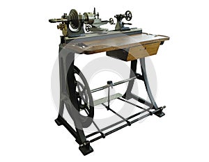 Vintage old turning lathe machine isolated over white background