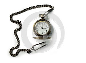 Vintage old watch on a chain. hand holding a watch on a chain.