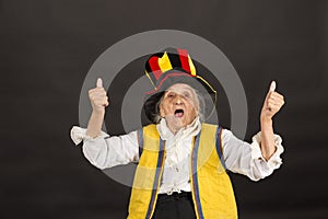 Vintage old woman wearing cylinder and a yellow vest