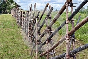 vintage old wooden fence out of sticks