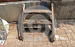 Vintage Old Wooden Plant Rack/ Shelf/ Ladder/ Stool Chair with Dirty Wall Background - Outdoor Garage/ Abandoned Junkyard/ Home Ga