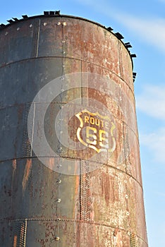 Vintage rusty Route 66 sign painted on metal tank