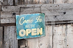 Vintage open sign on old wooden door