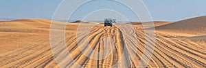 Vintage open top 4x4 SUV in the desert in Dubai, UAE