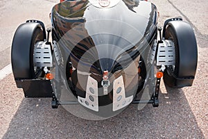 vintage open-top car at the yacht show in Monaco on a sunny day, leather seats, spoked wheels, close-up