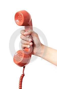 Vintage orange telephone handset over white background