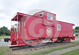 Antique red caboose on railroad
