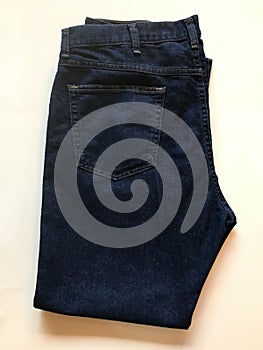 A vintage pair of folded denim blue jeans- FASHION - DENIM - AMERICAN STYLE