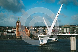 Vintage Panorama of peace bridge in Derry or Londonderry spanning across the river on a sunny spring day. Beautiful modernist