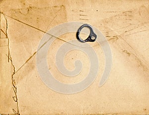 vintage paper envelope with old metallic soda Can ring pull