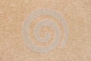 Vintage paper texture cardboard background close-up. Recyclable material, has inclusions of cellulose. Background for