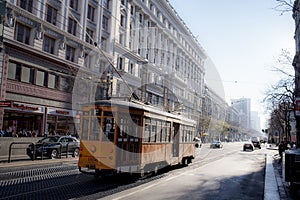 San Francisco, California, United States-circa 2015-Vintage Passenger Commuter Street Car Travels along Market Street in Downtown