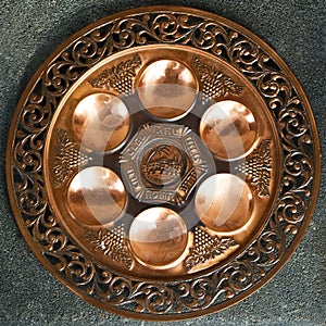 Vintage Passover Seder Plate on dark background.