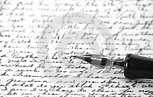 A vintage pen on a handwritten paper