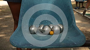 Vintage Petanque Balls on Old Blue Chair