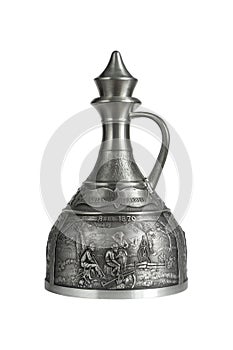 Vintage pewter decanter isolated on a white background. Photo with a shallow depth of field