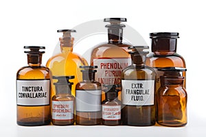 Vintage pharmacy bottles on white background