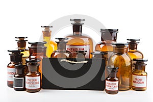 Vintage pharmacy bottles on white background