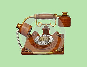 Vintage phone, Wooden telephone isolated on green pastel color background with clipping path.