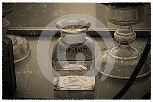 A vintage photo of a bottle with the inscription Spiritus