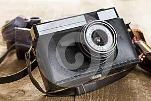 Vintage photo camera and blank film strip