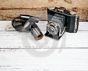 Vintage photo camera with film roll.