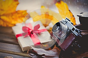 Vintage photo camera and gift box