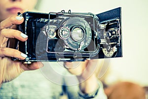 Vintage Photo Camera in Hands