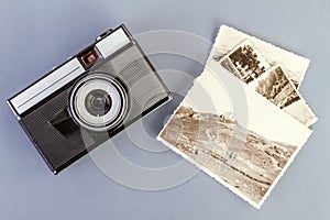 Vintage photo camera and old photos