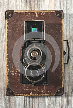 Vintage photo camera on wooden background