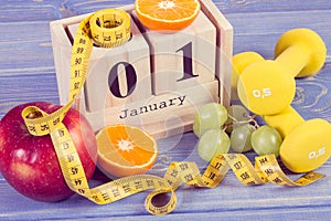 Vintage photo, Cube calendar, fruits, dumbbells and tape measure, new years resolutions