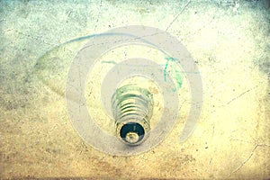 vintage photo of a disassembled tungsten light bulb on white