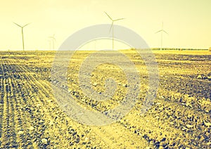 Vintage photo of field with windmills