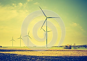 Vintage photo of field with windmills