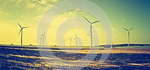 Vintage photo of field with windmills