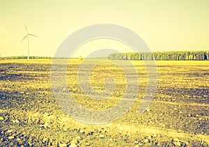 Vintage photo of field with windmills