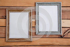 Vintage photo frames on wooden background with space for text and various photos photo