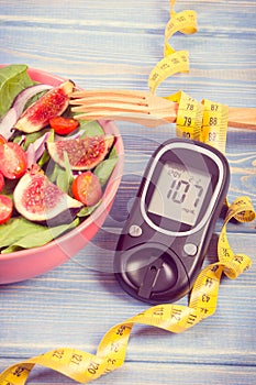 Vintage photo, Fruit and vegetable salad and glucometer with tape measure, concept of diabetes, slimming and healthy nutrition