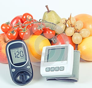Vintage photo, Glucose meter, blood pressure monitor and fruits with vegetables, healthy lifestyle concept